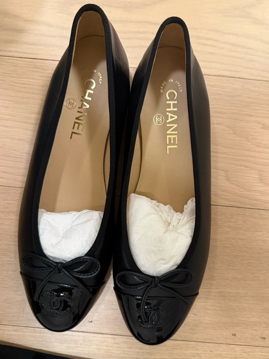CHANEL Shoes - CHANEL Black Leather Ballet Flats with Patent Cap Toe and Bow